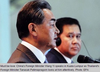 China's Foreign Minister Wang Yi, speaks in Kuala Lumpur, as Thailand's Foreign Minister Tanasak Patimapragorn looks at him attentively