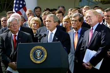 President George Bush, surrounded by leaders of the House and Senate, announces the Joint Resolution to Authorize the Use of United States Armed Forces Against Iraq, 2 October 2002